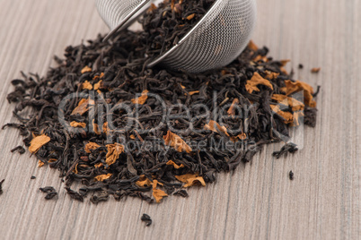 Black dry tea with petals