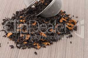 Black dry tea with petals