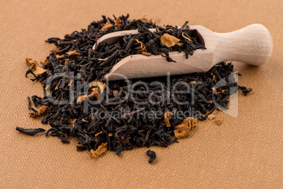 Black Dry Tea with a Wooden Spoon