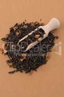 Black Dry Tea with a Wooden Spoon