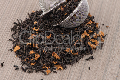 Black dry tea with petals