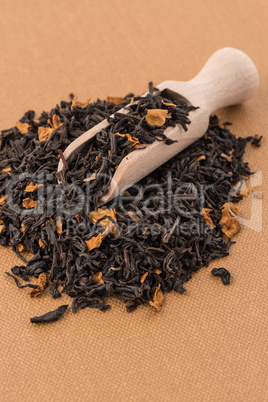 Black Dry Tea with a Wooden Spoon