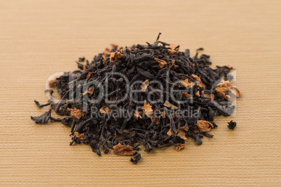 Black dry tea with petals