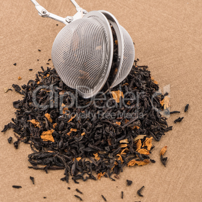 Black dry tea with petals