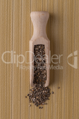 Wooden scoop with chia seeds