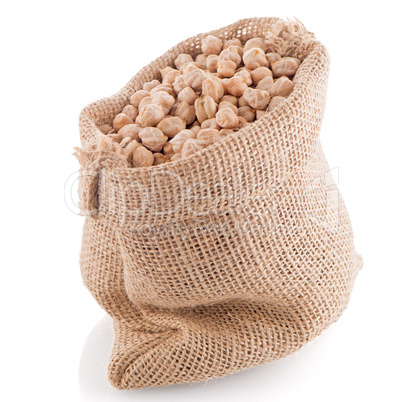 Uncooked chickpeas on burlap bag