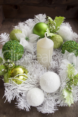 New Year candle and festive wreath