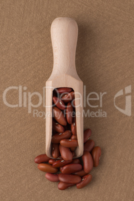 Wooden scoop with red beans