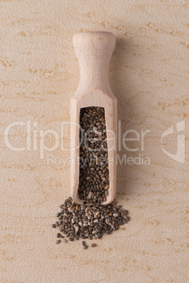 Wooden scoop with chia seeds