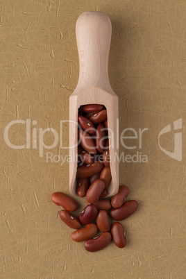 Wooden scoop with red beans