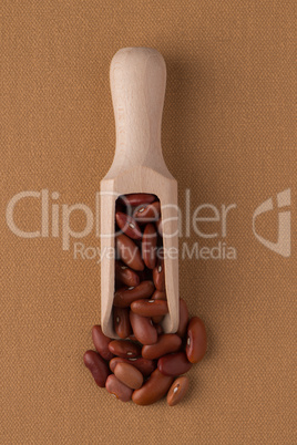 Wooden scoop with red beans