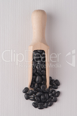 Wooden scoop with red beans