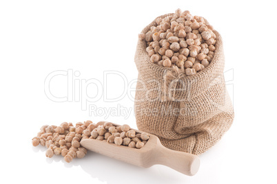 Uncooked chickpeas and wooden scoop