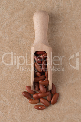 Wooden scoop with red beans