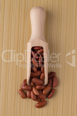 Wooden scoop with red beans