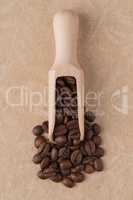 Wooden scoop with coffee beans