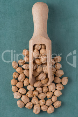 Wooden scoop with chickpeas