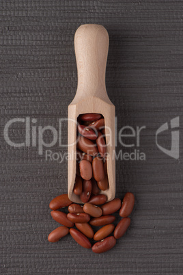 Wooden scoop with red beans