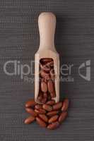 Wooden scoop with red beans