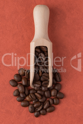 Wooden scoop with coffee beans