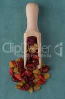 Wooden scoop with mixed dried fruits