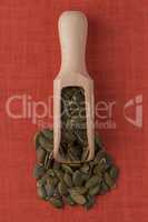 Wooden scoop with pumpkin seeds