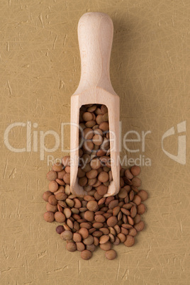 Wooden scoop with lentils