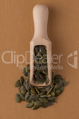 Wooden scoop with pumpkin seeds