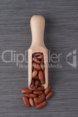 Wooden scoop with red beans