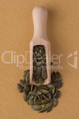 Wooden scoop with pumpkin seeds