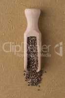 Wooden scoop with chia seeds