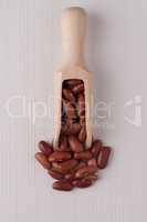 Wooden scoop with red beans