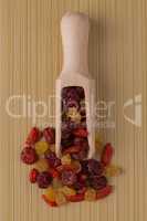 Wooden scoop with mixed dried fruits