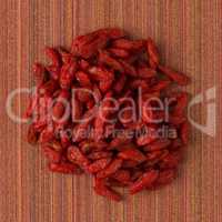 Circle of dry red goji berries