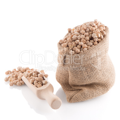 Uncooked chickpeas and wooden scoop