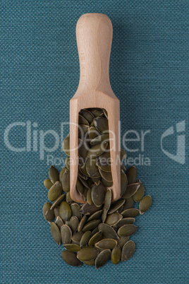 Wooden scoop with pumpkin seeds