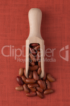 Wooden scoop with red beans