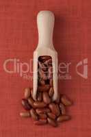 Wooden scoop with red beans