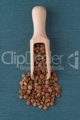 Wooden scoop with lentils