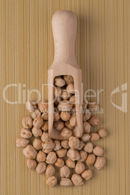 Wooden scoop with chickpeas
