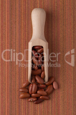 Wooden scoop with red beans