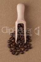 Wooden scoop with coffee beans