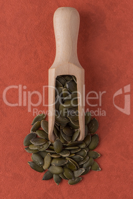 Wooden scoop with pumpkin seeds