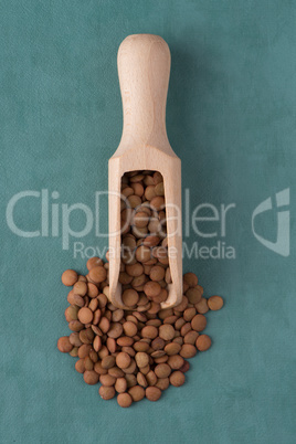 Wooden scoop with lentils