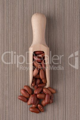 Wooden scoop with red beans