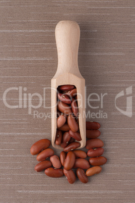 Wooden scoop with red beans