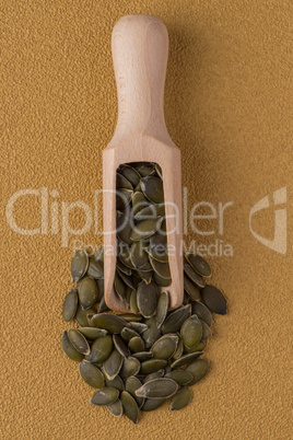 Wooden scoop with pumpkin seeds