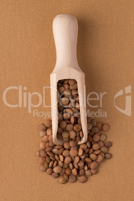 Wooden scoop with lentils