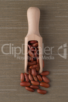 Wooden scoop with red beans