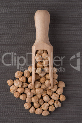 Wooden scoop with chickpeas